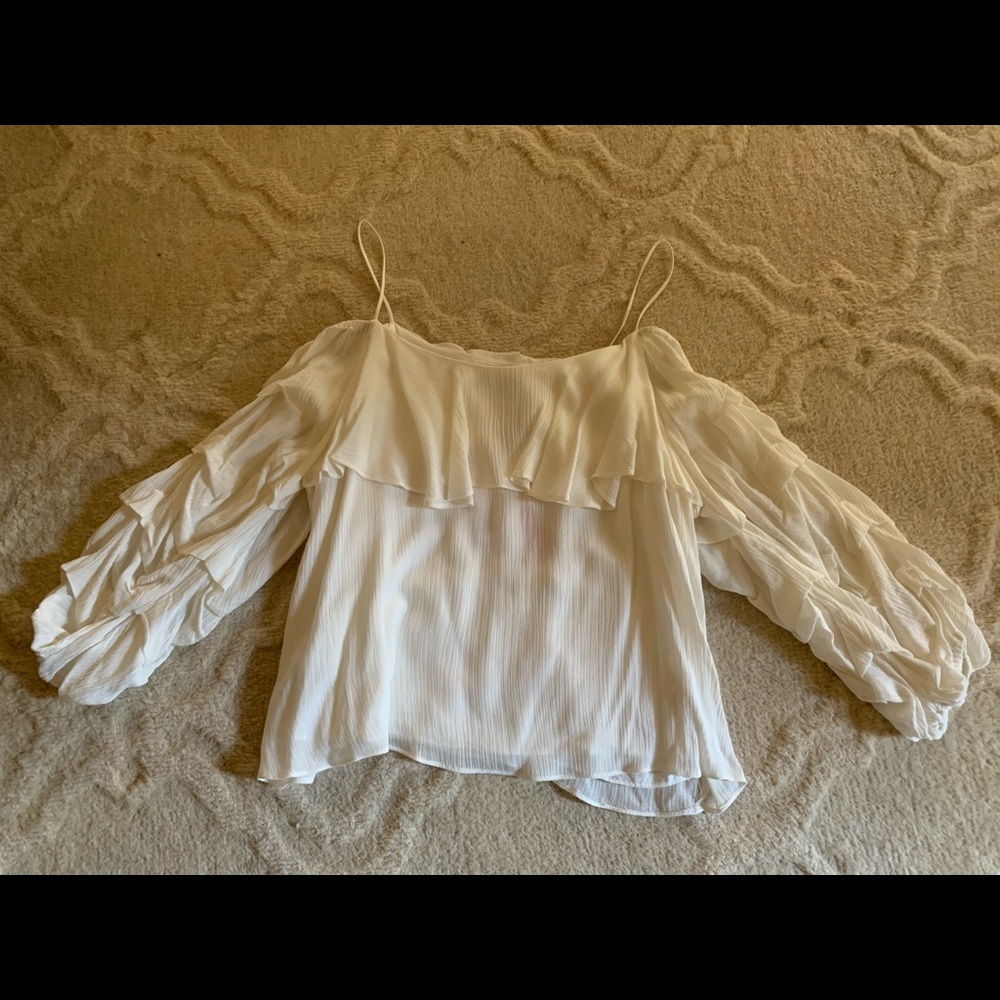 Off white cold shoulder blouse.